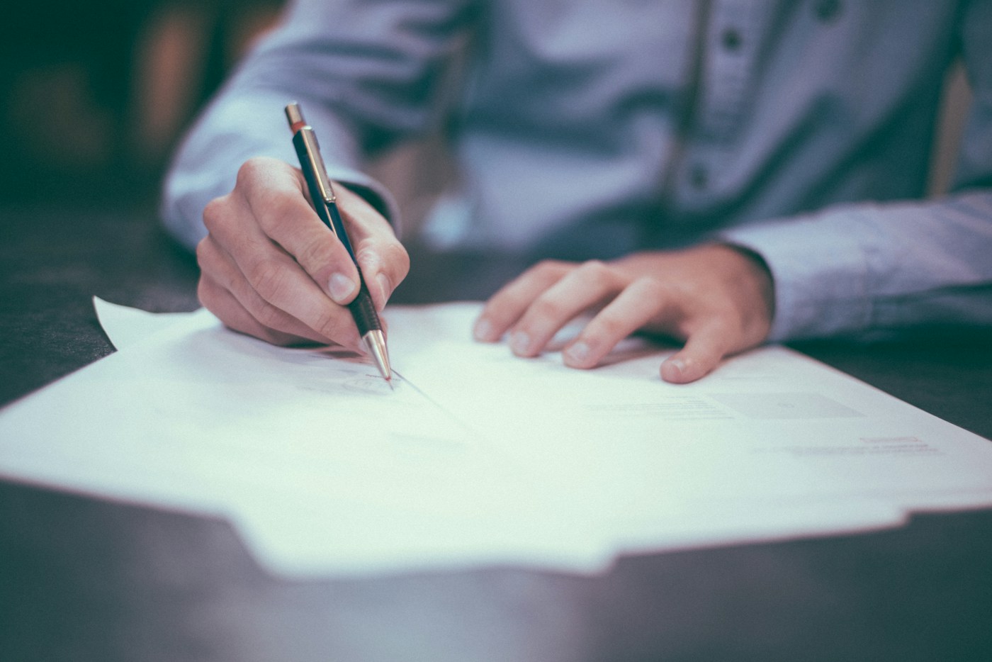 Professionals reviewing documents at a desk